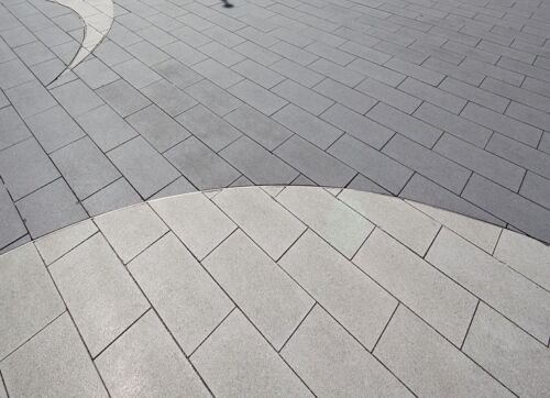 Unilock Arcana walkway featuring natural stone finish for elegant outdoor pathways.
