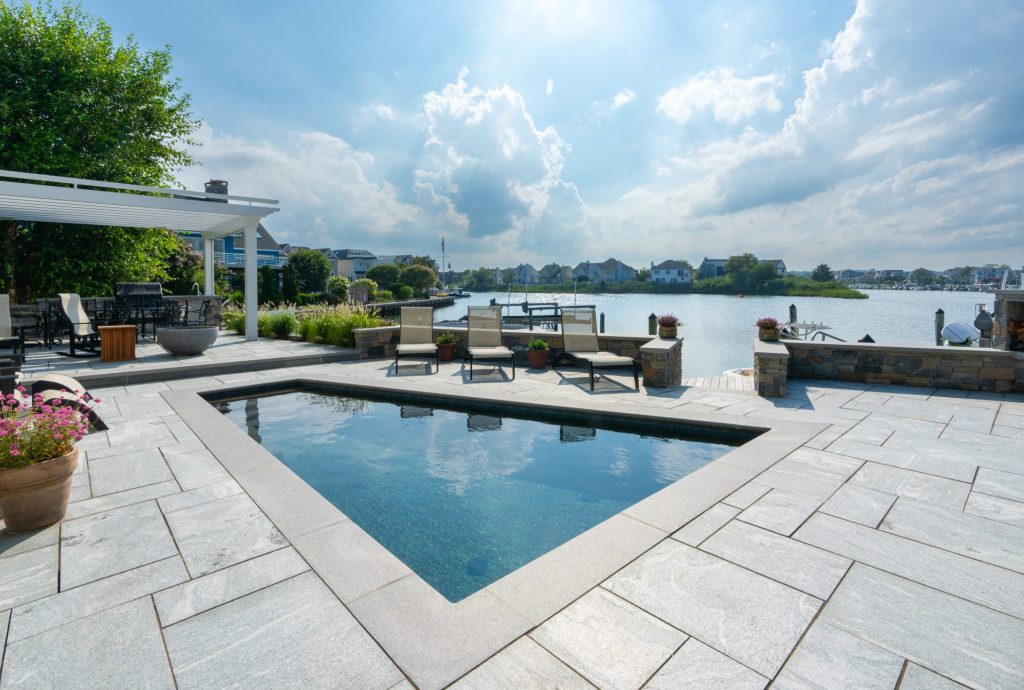 natural stone pool patio with granite pavers