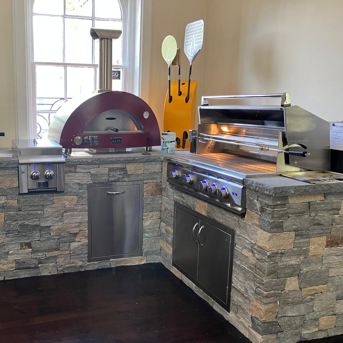 red alfa pizza oven and summerset grill inside showroom at old station landscape supply