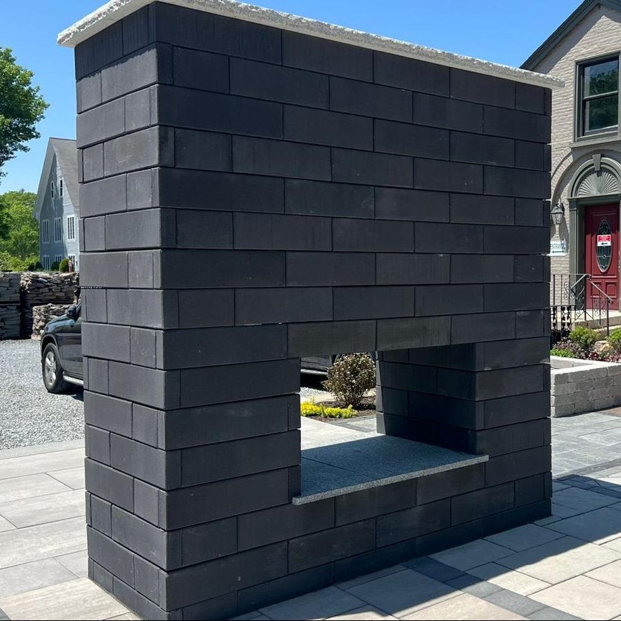 outdoor display Unilock Ucara fire place mounted system view at old station outdoor and landscape supply