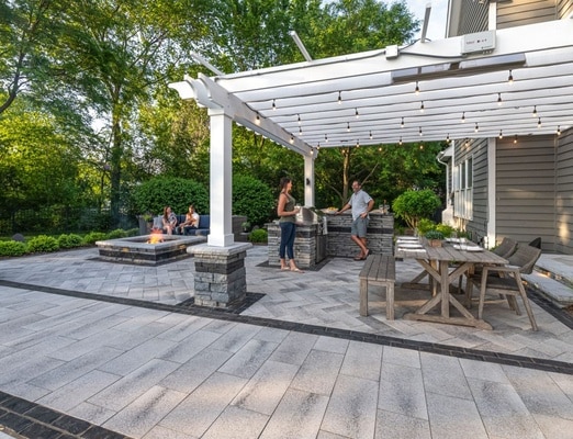 Unilock Beacon Hill Smooth XL and Mattoni pavers on a patio with pergola, dining area, and fire feature.