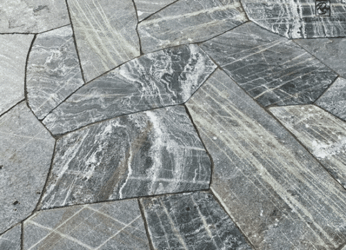 American Mist sawn flagstone patio with circular fire pit.