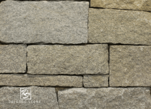 Close-up photo of Dusty Rose Ashlar Natural Thin Stone Veneer texture.