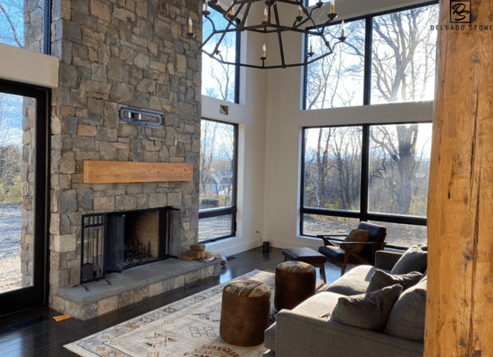 Photo of Fieldstone Dark Mixed Pattern Natural Thin Stone Veneer installed on an interior fireplace feature wall.
