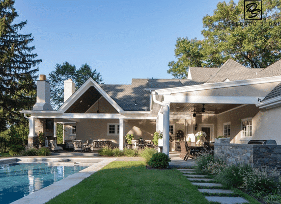 Photo of Fieldstone Dark Ashlar Natural Thin Stone Veneer installed on a luxury poolside outdoor living area.