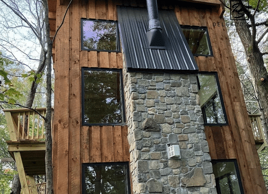 Photo of Fieldstone Dark Square and Rectangle Natural Thin Stone Veneer installed on a residential exterior wall.