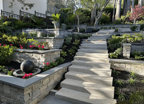 Photo of Liberty Hill Ashlar Natural Thin Stone Veneer installed on retaining walls and dimensional garden steps.