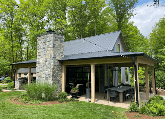 Photo of Liberty Hill Square and Rectangle Natural Thin Stone Veneer installed on the exterior walls of a residential outdoor living pavilion.