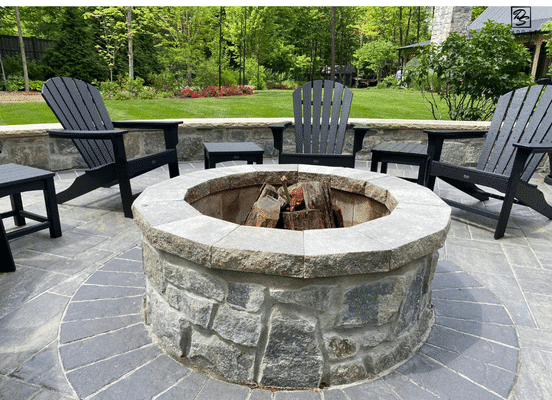 Photo of Liberty Hill Square and Rectangle Natural Thin Stone Veneer installed on a backyard fire pit surround.