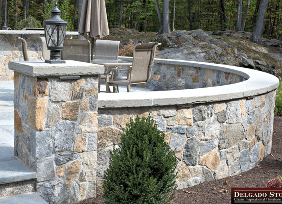 Montauk Blend natural stone veneer curved patio wall installation