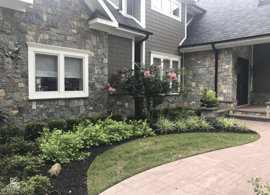 Photo of New York Blend Square and Rectangle Natural Thin Stone Veneer installed on a residential entrance facade.
