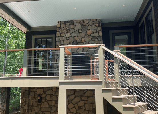 Photo of Nutmeg Ridge Mosaic Natural Thin Stone Veneer installed on the exterior walls of a covered porch and balcony.
