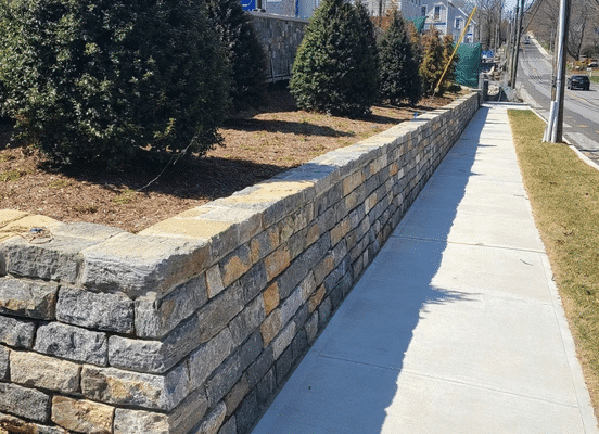 Old New England Wall natural stone veneer retaining wall installation