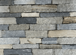 Photo of Taconic Ridge Ledge Natural Thin Stone Veneer swatch featuring stacked stone pieces with naturaPhoto of Taconic Ridge Ledge Natural Thin Stone Veneer swatch featuring stacked stone pieces with natural color variation.l color variation.