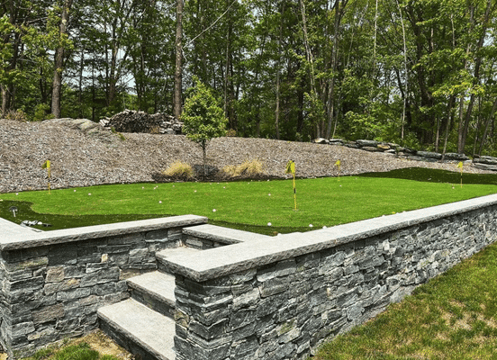 Photo of American Mist Ashlar Natural Thin Stone Veneer installed on the retaining walls of garden stairs.