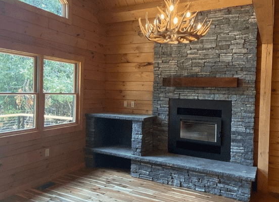Photo of American Mist Ledge Natural Thin Stone Veneer installed on an indoor fireplace.