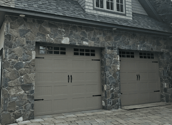 Photo of American Mist Mosaic stone veneer by Delgado Stone installed on a luxury home exterior, showcasing natural stone veneer craftsmanship and timeless New England outdoor living design.