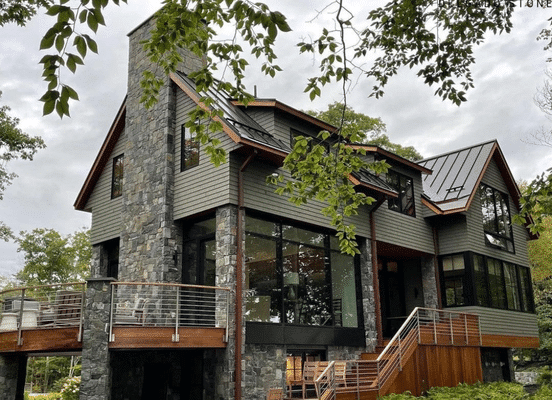 Photo of American Mist Square and Rectangle Natural Thin Stone Veneer installed on the exterior walls of a residence.