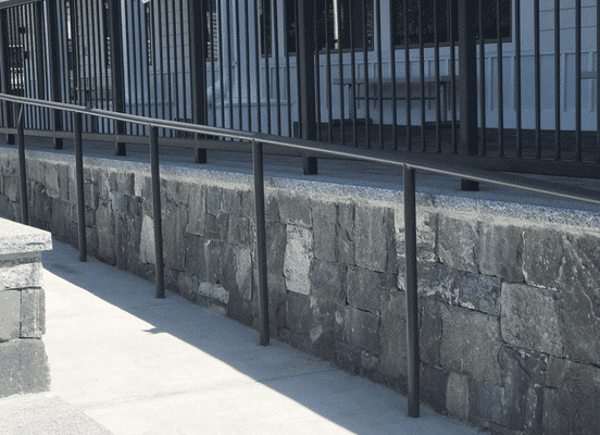 Photo of American Mist Square and Rectangle Natural Thin Stone Veneer installed on a residential garden wall.