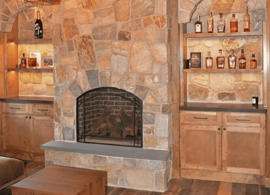 Photo of Colonial Tan Ashlar Natural Thin Stone Veneer installed on an interior fireplace in a residential living space