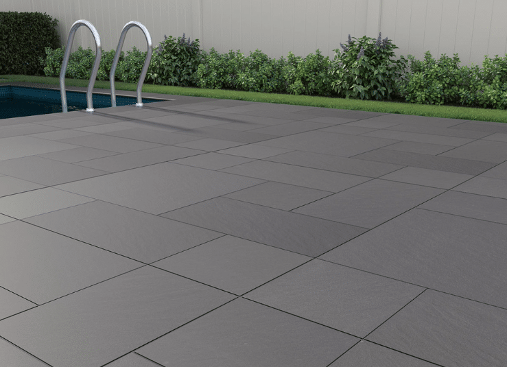 Pool deck finished with Arterra True Blue porcelain pavers